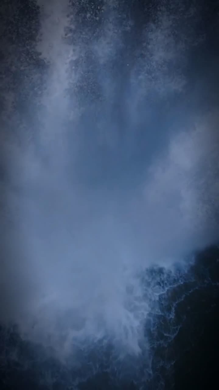 Floating past a forest waterfall