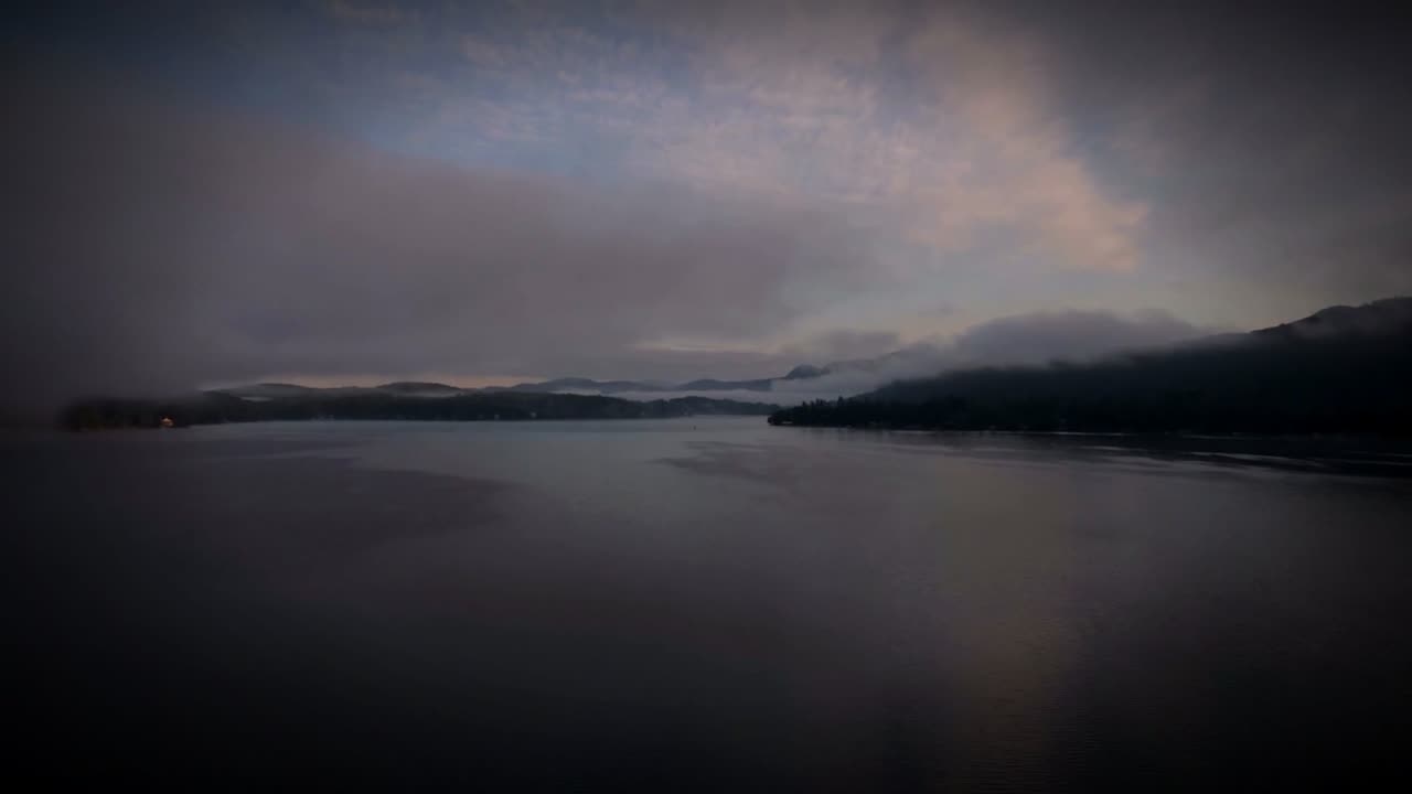 Misty mountain lake at dawn